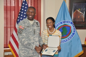 General William E. "Kip" Ward, commander, U.S. Africa Command presents Mykayla Fernandes the first-place award